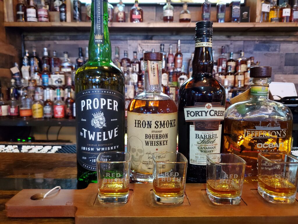 A variety flight of Whiskey's from Lumber Axe in Fort Myers
